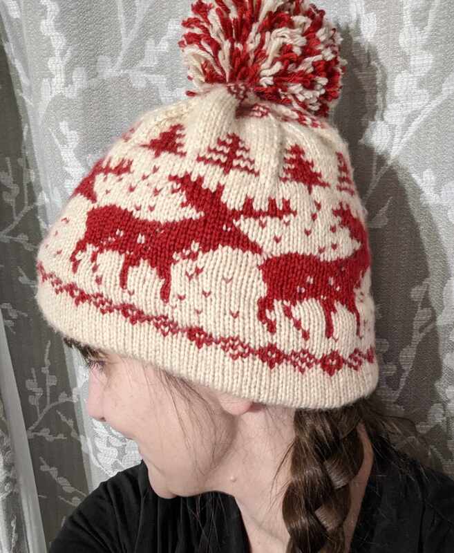 A woman wears the iconic hat from Home Alone worn by Kevin McCallister